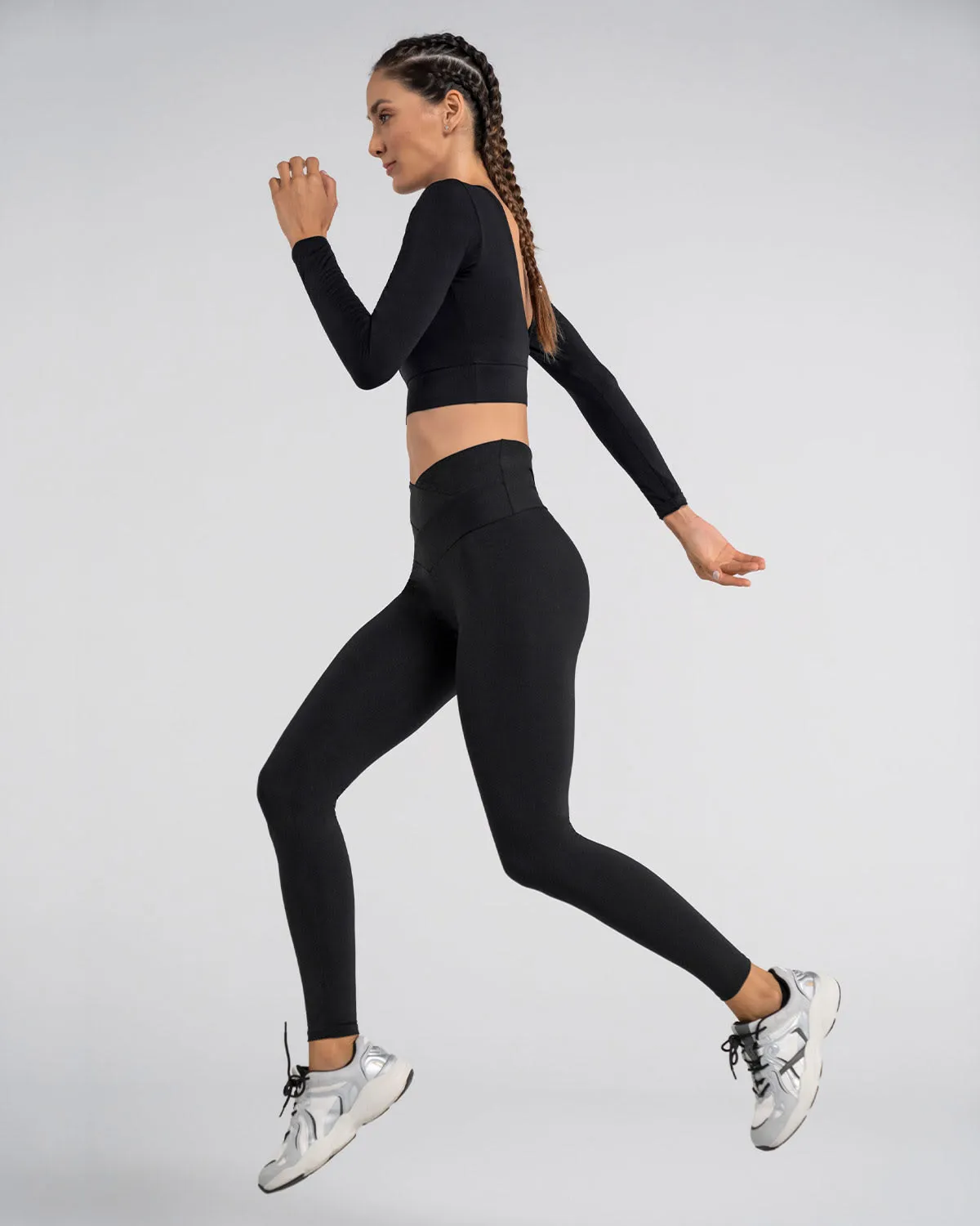 Legging deportivo de compresión con pretina cruzada en forma de V